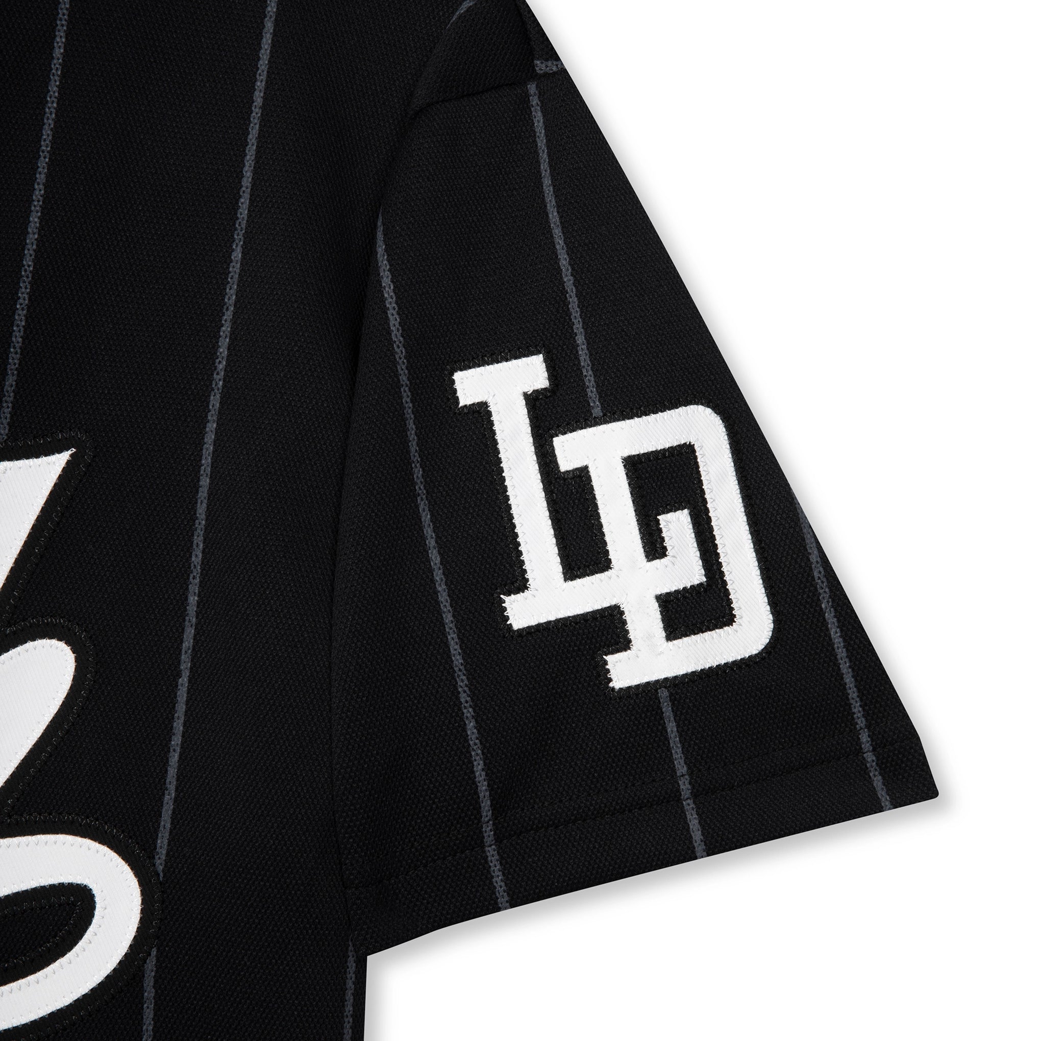 Black pinstripe shirt with white logo on a white background