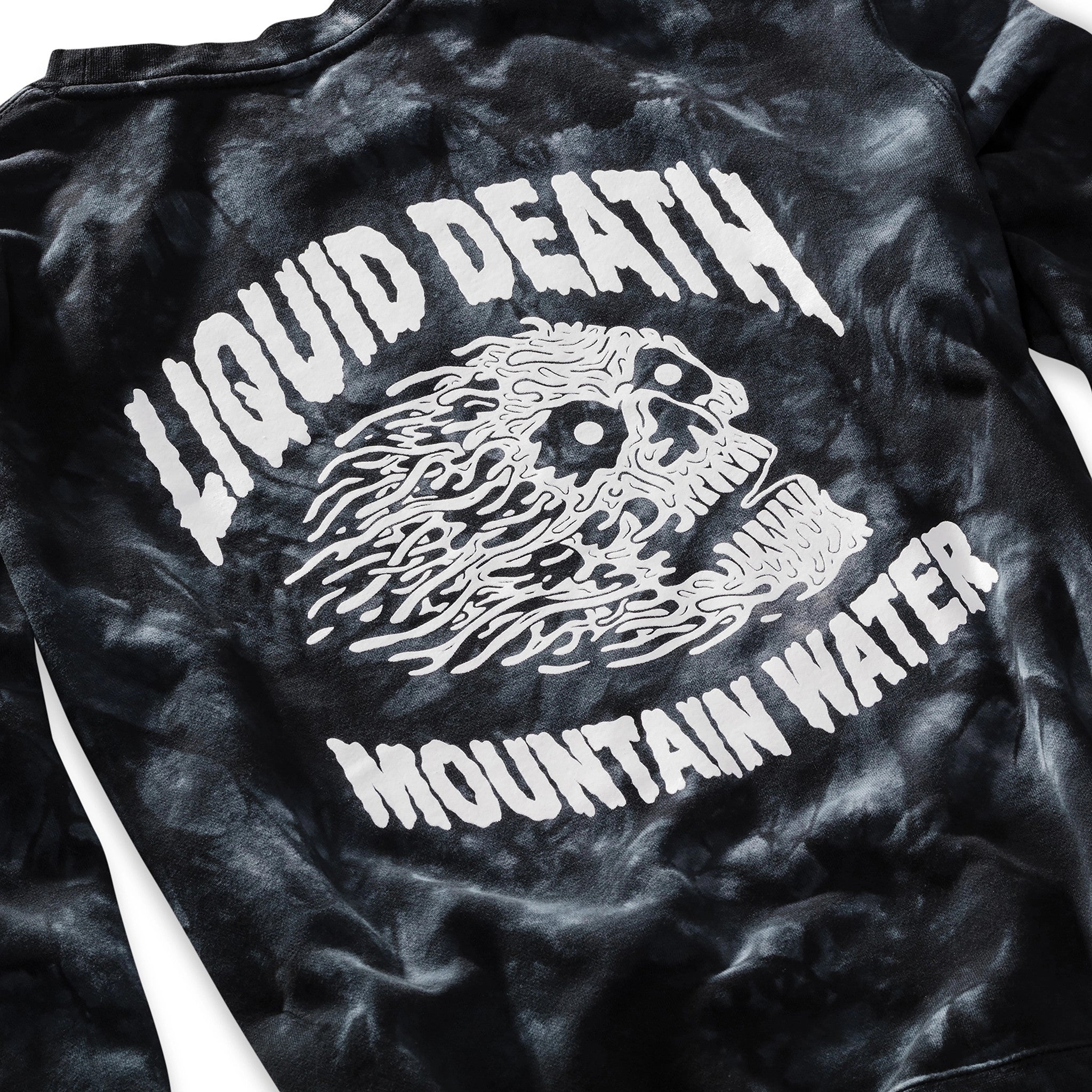 Black tie-dye t-shirt with white graphic and text 'LIQUID DEATH MOUNTAIN WATER' on a plain background
