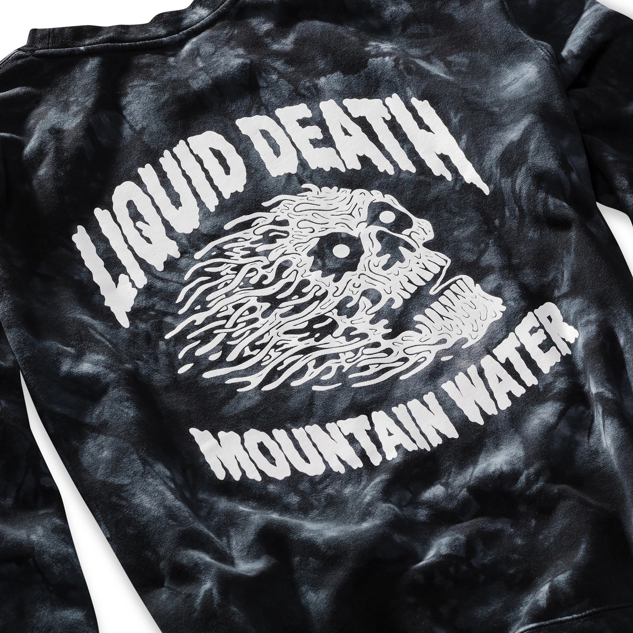 Black tie-dye t-shirt with white graphic and text 'LIQUID DEATH MOUNTAIN WATER' on a plain background