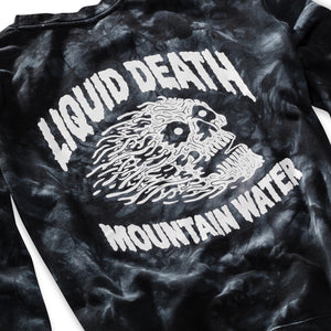 Black tie-dye t-shirt with white graphic and text 'LIQUID DEATH MOUNTAIN WATER' on a plain background