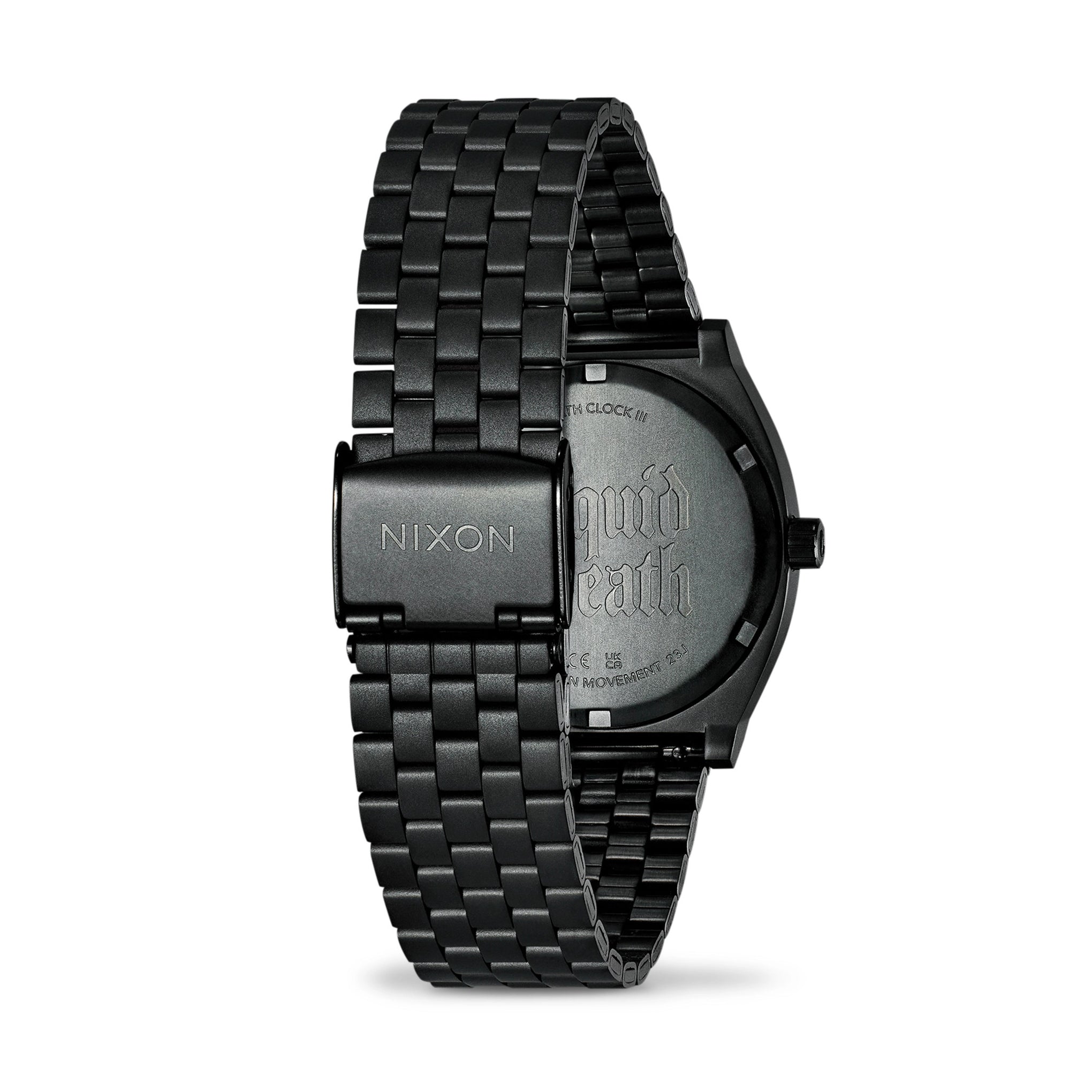 Black Nixon watch with metal band on a white background