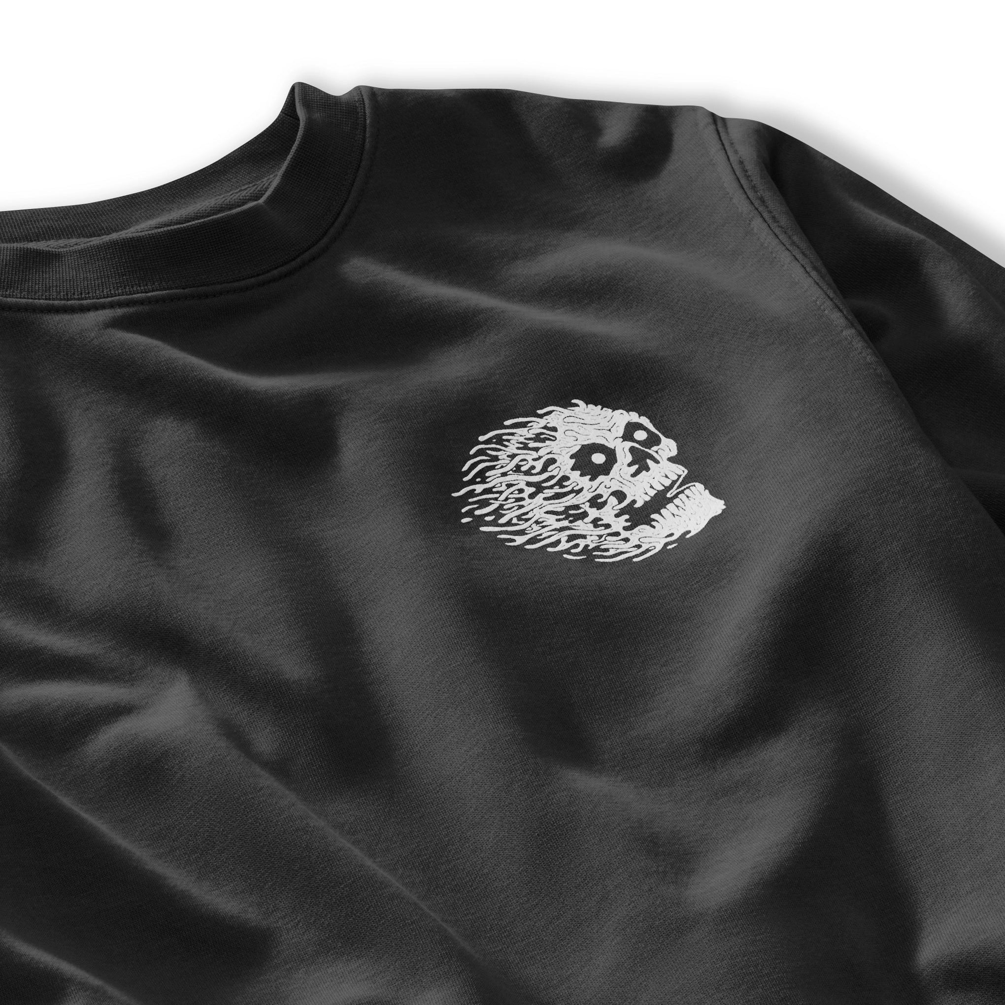 Black sweatshirt with a white embroidered design on a white background