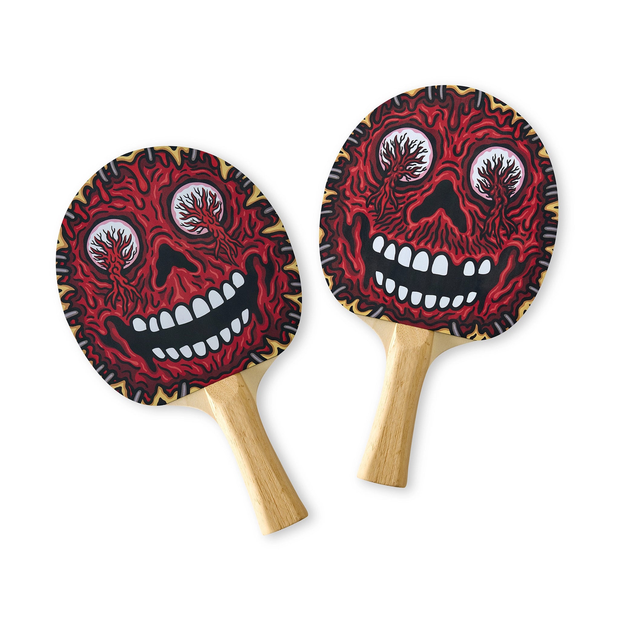 Two ping pong paddles with red and black skull designs on a white background