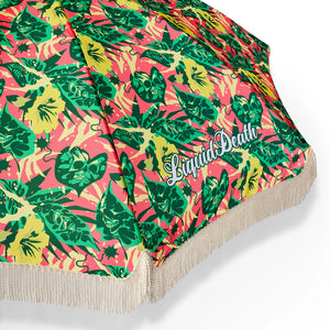 Umbrella with a colorful leaf pattern and 'Liquid Death' branding on a white background