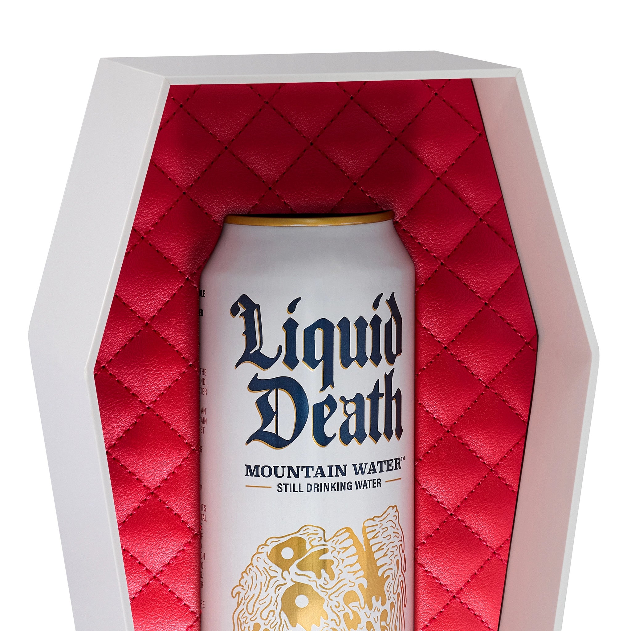 Can of 'Liquid Death' mountain water in a red quilted coffin