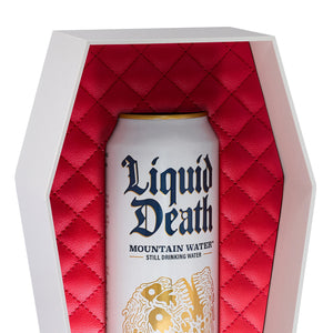 Can of 'Liquid Death' mountain water in a red quilted coffin