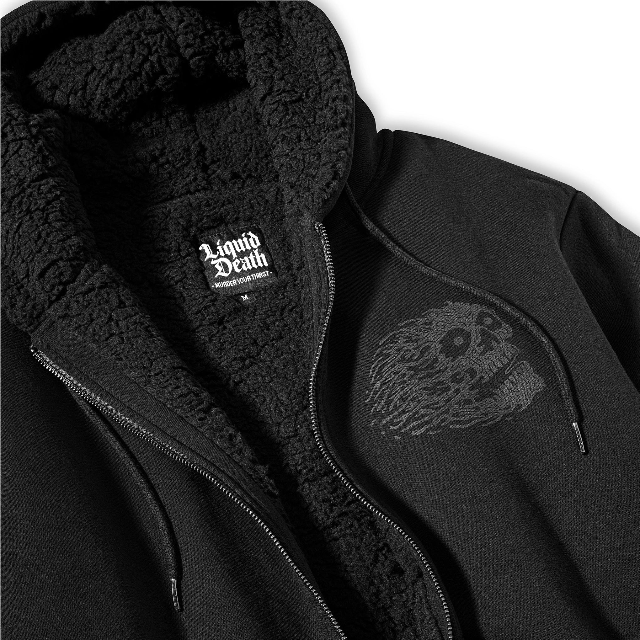 Black jacket with sherpa lining and skull design on a white background