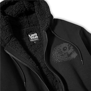 Black jacket with sherpa lining and skull design on a white background