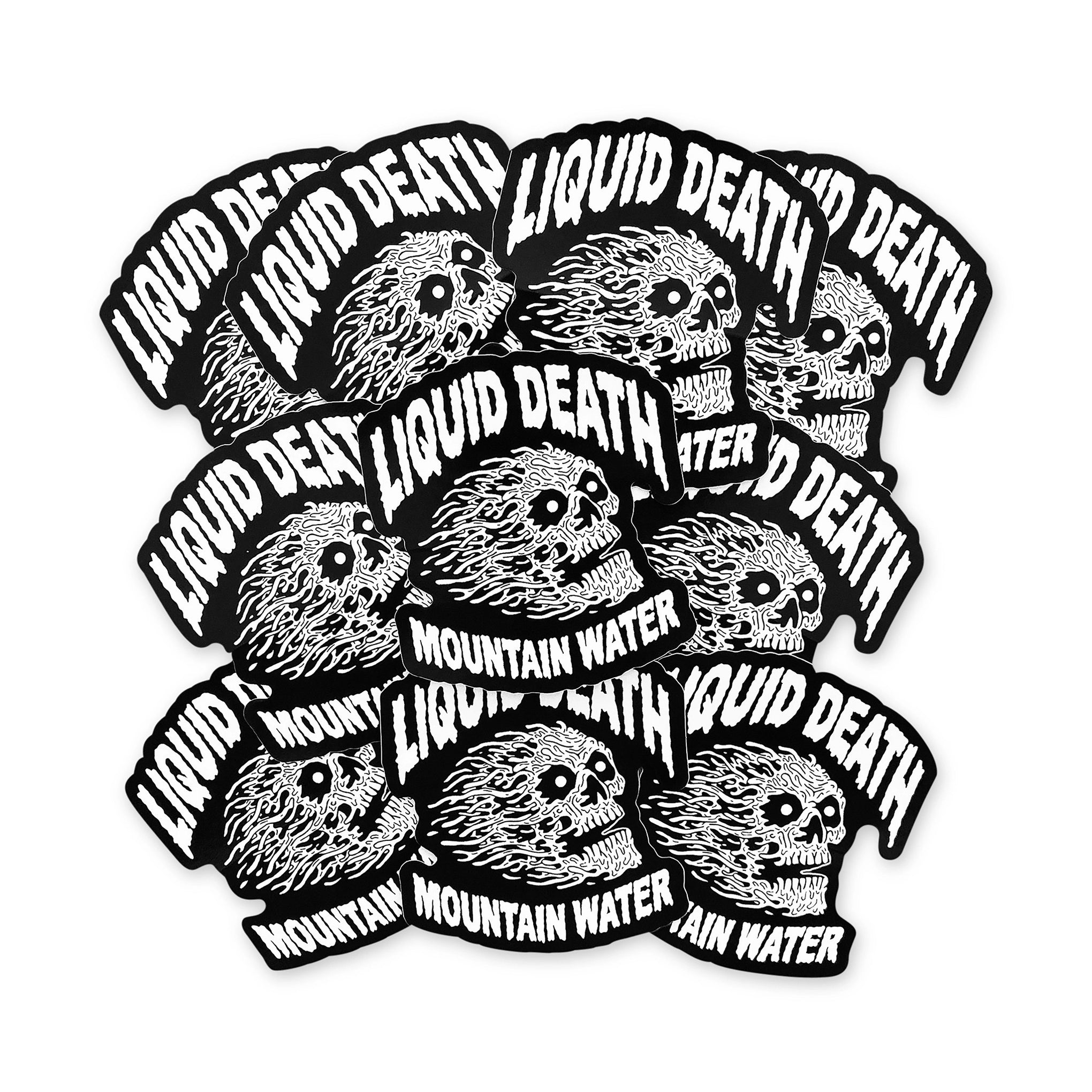 Multiple stickers with 'Liquid Death' and 'Mountain Water' text and skull design on a white background.
