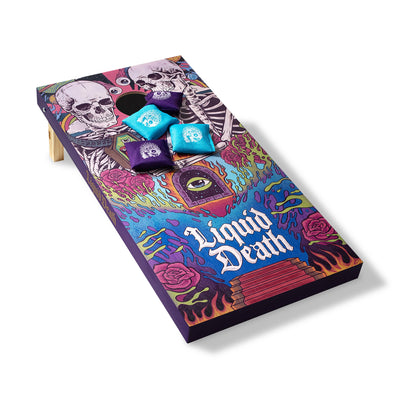 Colorful cornhole board with 'Liquid Death' design and dice on a white background