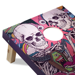 Cornhole board with colorful skull and skeleton design on a white background