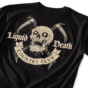 Black t-shirt with a skull and crossed axes design and 'Liquid Death Country Club' text.