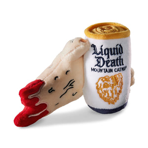 Toy resembling a bottle labeled 'Liquid Death' held by a plush cat toy.